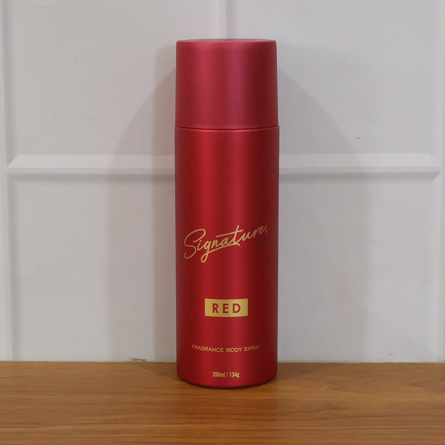 Signature red fragrance spray bottle design