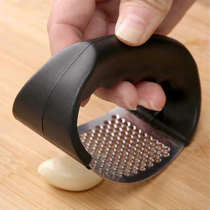 Curved garlic press for fresh garlic prep