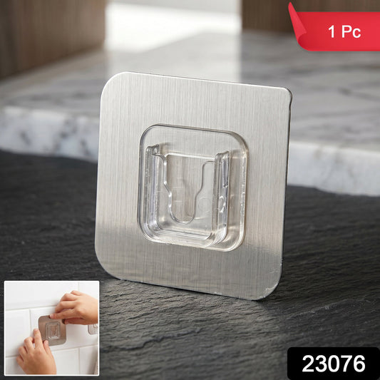 Self-adhesive wall hook holding kitchen utensils