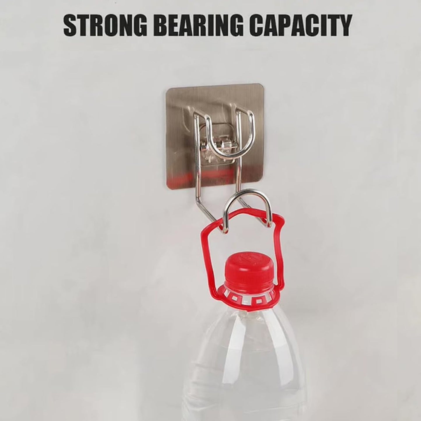 Adhesive hook holding kitchen towel