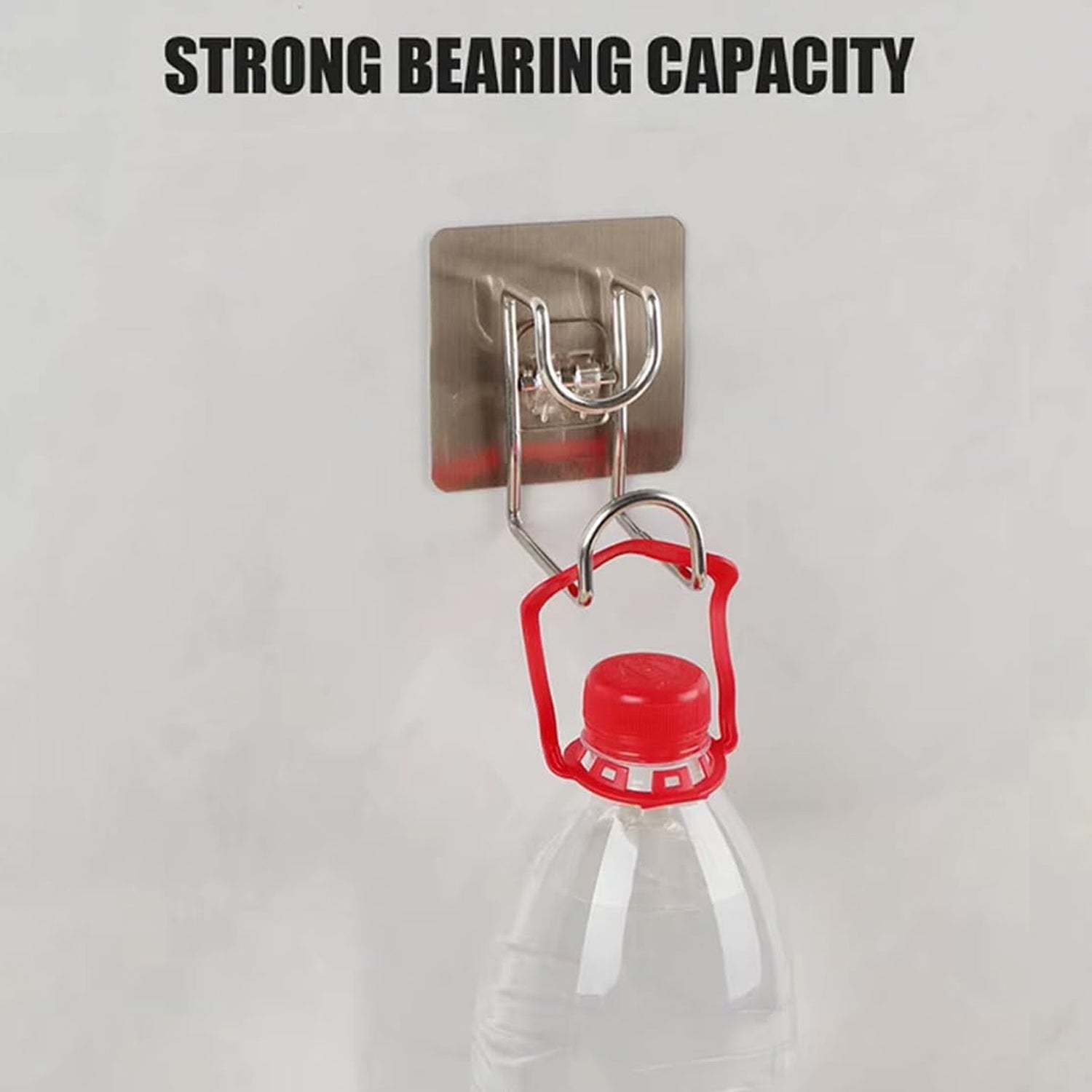 Adhesive hook holding kitchen towel