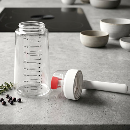 Glass Oil Dispenser Bottle 500ml Disassembled Showing Separate Glass Body with Measurement Markings and Auto-Flip Cap with White Handle and Red Lever